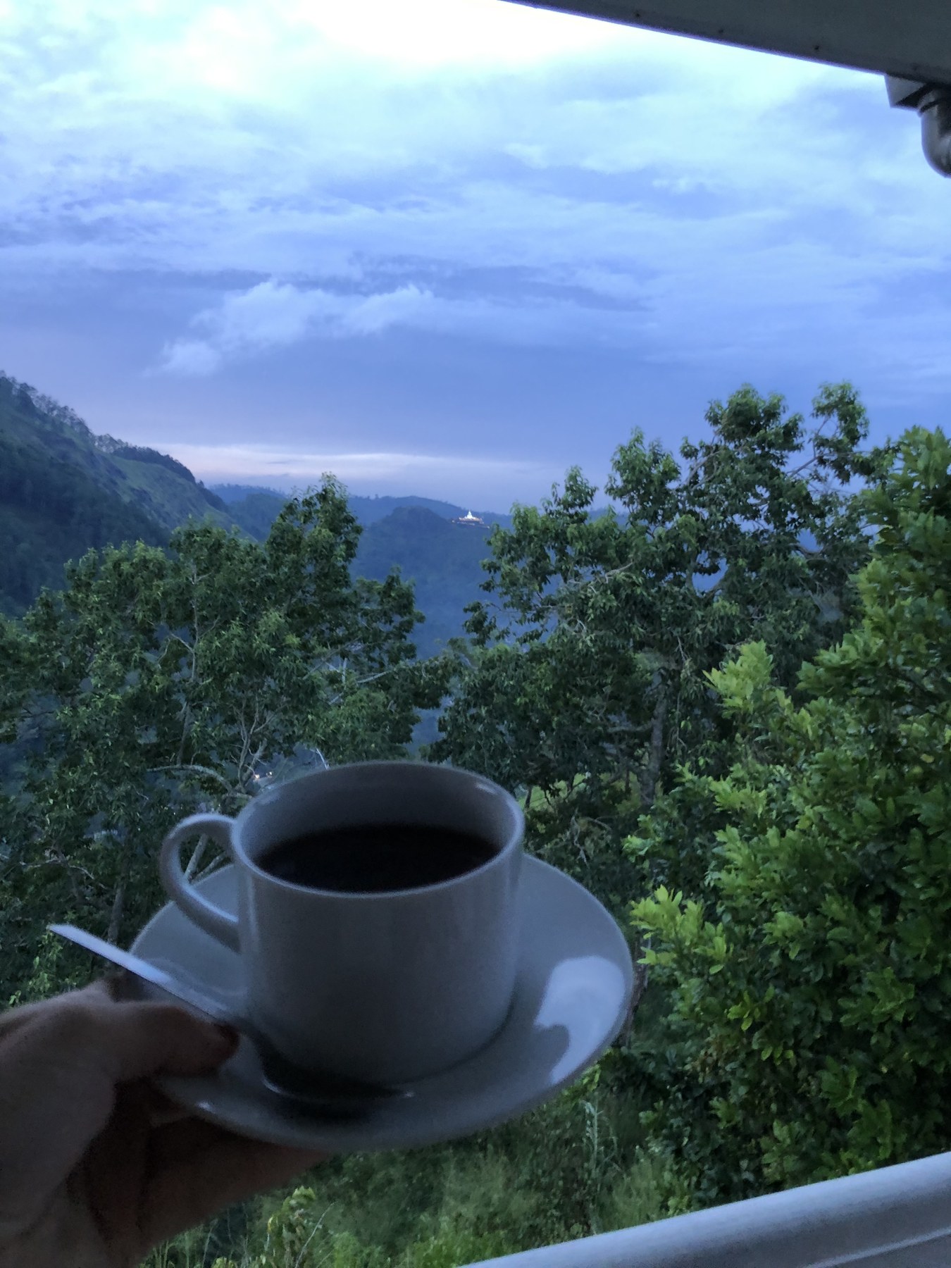 A cup of tea overlooking the green hills at Villa Krista, Ella