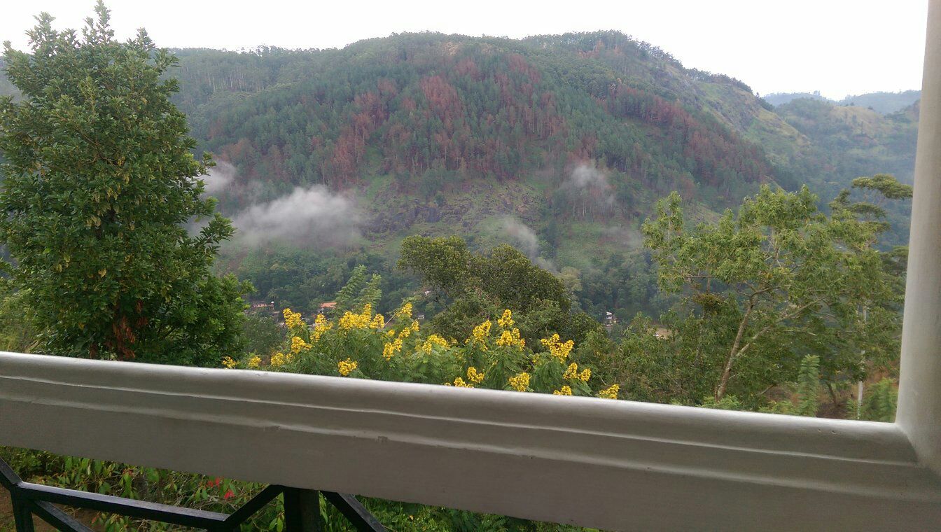 Misty green mountains seen from the villa